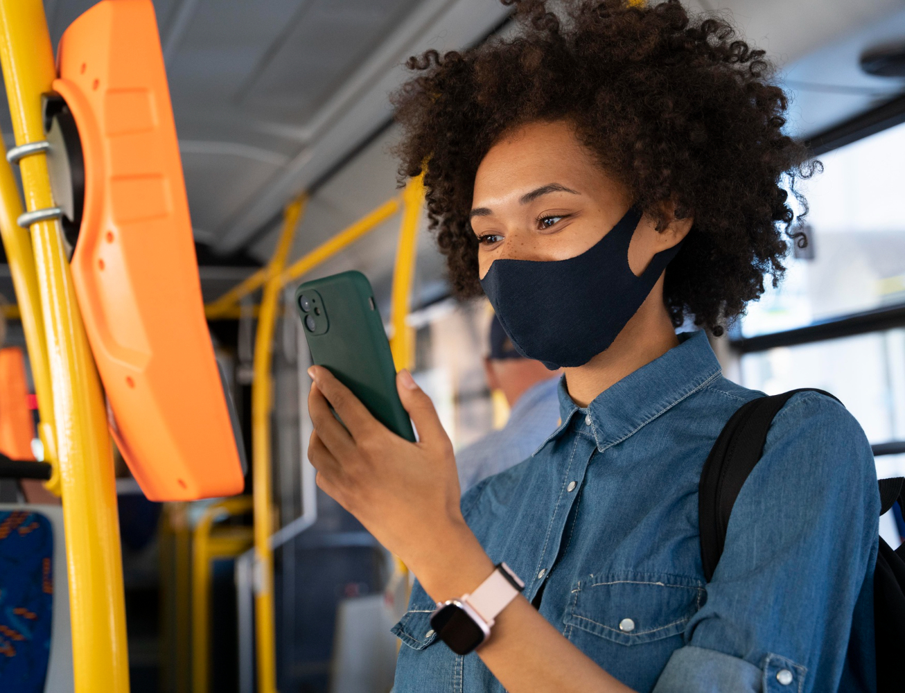 woman wearing a mask on the bus